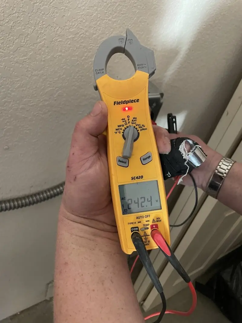 Voltage testing with clamp meter during Ceiling Fan Installation in Volney